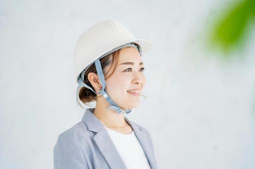A woman in a suit wearing a helmet, JPG A woman in a suit wearing a helmet, 女子, 女实业家, 头盔, JPG