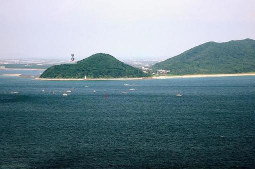 神島から望む伊良湖岬 伊良湖岬灯台,灯台,伊良湖岬の写真素材