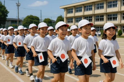 運動会の入場行進をする小学1年生 運動会の入場行進をする小学1年生の写真