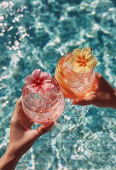 プールサイドでの夏の乾杯 プールサイドでの夏の乾杯の写真