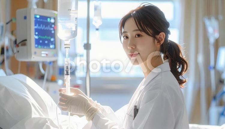 病室で点滴をする看護師 病室,看護師,点滴の写真素材