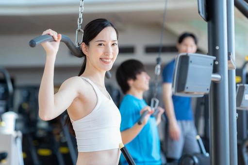 スポーツジムでトレーニングをする若い男女 スポーツジム,フィットネス,ダイエットの写真素材