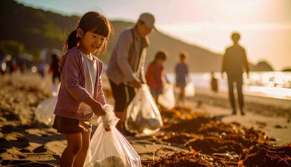 ボランティアで海辺のごみ拾いをする親子 ボランティアで海辺のごみ拾いをする親子の写真