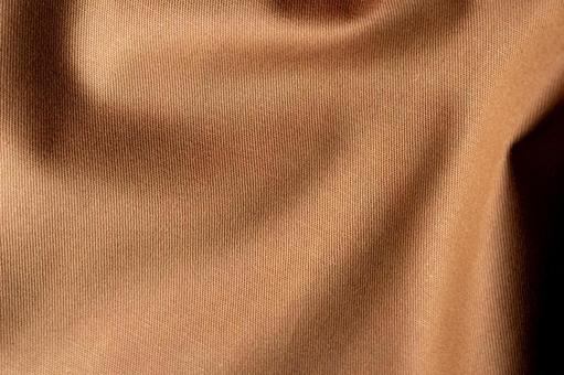 ブラウン生地の陰影と折れ目 布,ベージュ,茶の写真素材