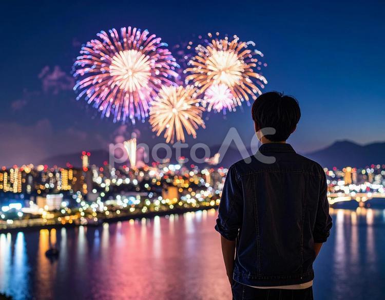 夜空に咲く花火を見つめる少年の後ろ姿 花火,日本人,少年の写真素材