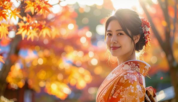 紅葉を眺める晴れ着姿の女性のポートレートの写真