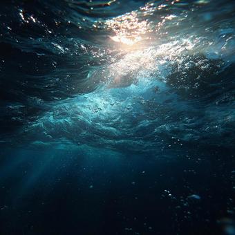 水面からの光が降り注ぐ海 水面からの光が降り注ぐ海の写真