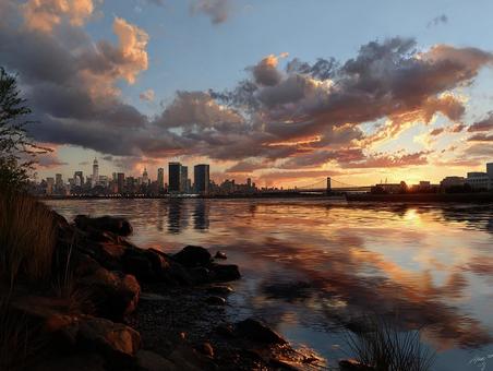 夕焼けに染まる水辺の都市景観 夕焼けに染まる水辺の都市景観の写真