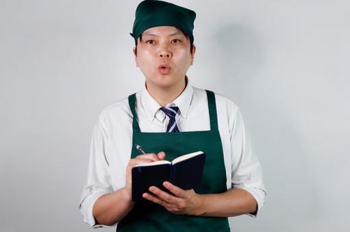メモを取る店員 メモを取る店員 男性,店員,メモの写真素材