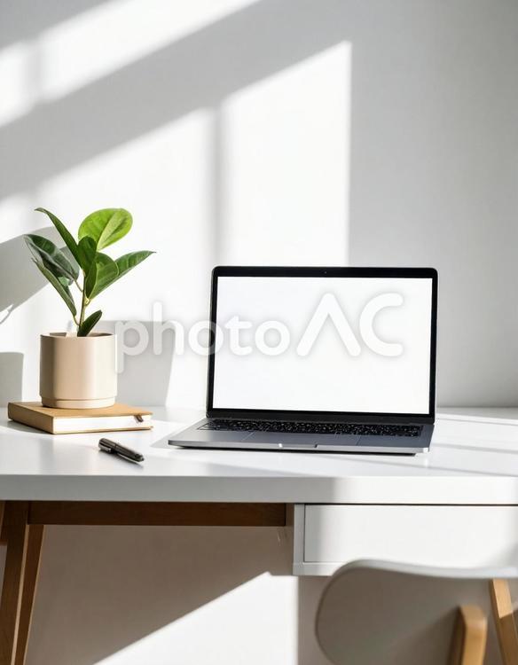 シンプルなデスクワーク風景 デスク,ノートpc,ペンの写真素材