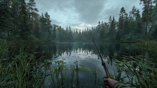 静寂な森の湖での釣りの写真