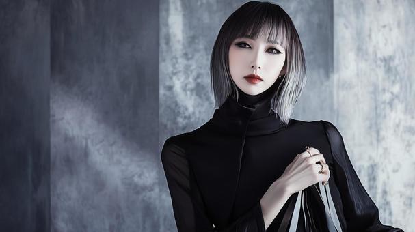 黒いドレスを着たボブヘアーの魅惑的な女性の写真