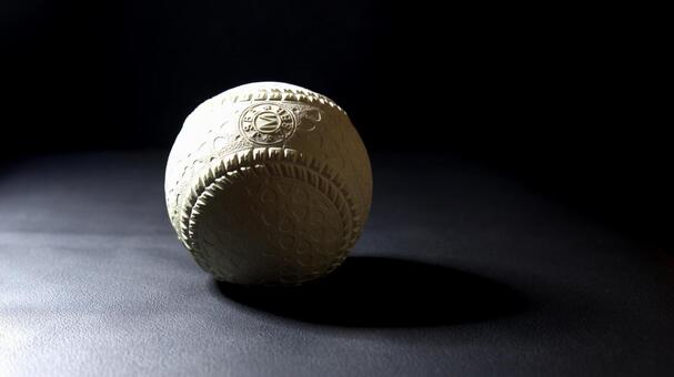 黒背景に映える軟式野球ボール 野球ボール,軟式野球,m号球の写真素材