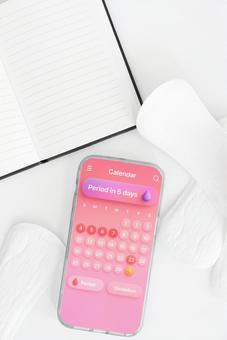 生理用ナプキンと生理周期アプリとノート 生理,月経,生理用品の写真素材