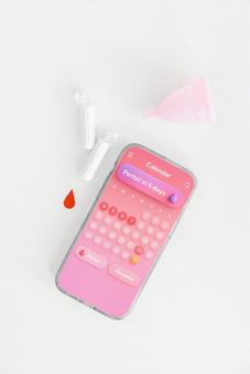 月経カップとタンポンとスマートフォン 生理,月経,生理用品の写真素材