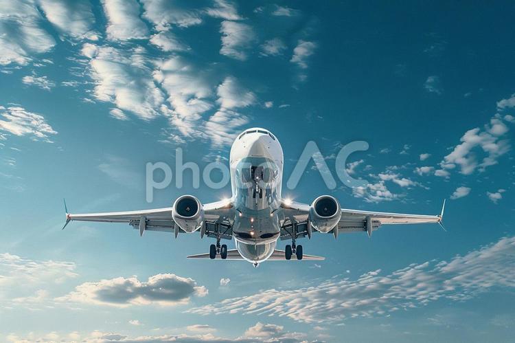 青空を飛ぶ旅客機と雲の風景 飛行機,青空,雲の写真素材