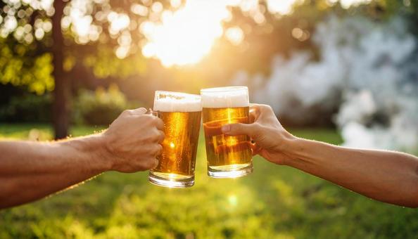 ビールで乾杯するバーベキュー ビールで乾杯するバーベキューの写真