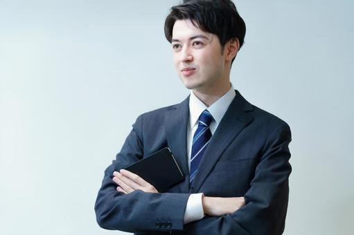 Young businessman posing with his arms crossed Young businessman posing with his arms crossed