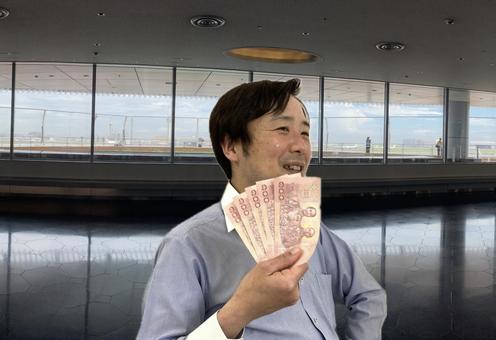 羽田空港にて、タイバーツをもって浮かれる 羽田空港にて、タイバーツをもって浮かれる タイ,バーツ,外貨の写真素材