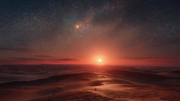 地平線に輝く天体と砂丘のコントラスト 地平線に輝く天体と砂丘のコントラストの写真