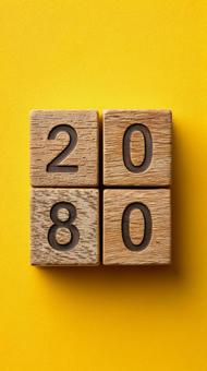 黄色背景に配置された2080年のブロック 黄色背景に配置された2080年のブロックの写真