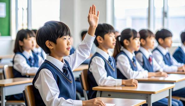 学校の授業中、手をあげる子供たち 学校の授業中、手をあげる子供たちの写真