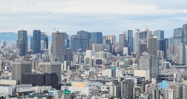 都市ビルと飛行機 都市ビルと飛行機 ビル,ビル群,大阪の写真素材