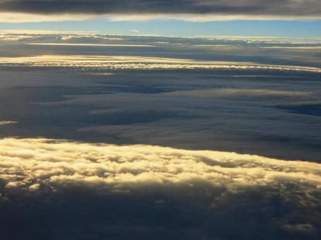 Photo, cloud layer, setting sun, between clouds, 