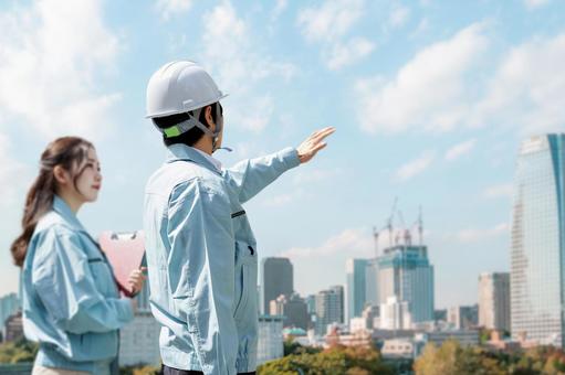 Asian workers having a meeting at the construction site, field operator, site supervision, construction, JPG