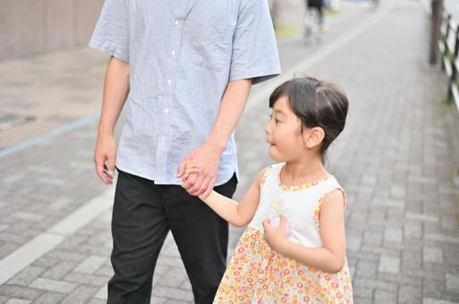 Girl taking a walk hand in hand with her father Summer 1, JPG Girl taking a walk hand in hand with her father Summer 1, JPG