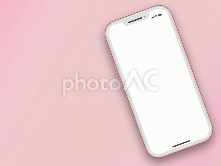 ピンクの壁紙背景のスマートフォン　３ スマホ,スマートフォン,携帯の写真素材