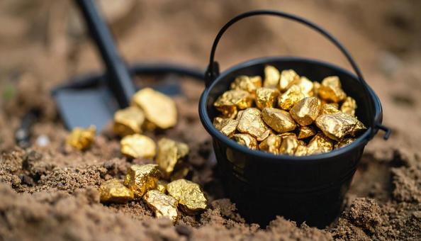 金を掘るイメージ 金塊と金属探知機 金を掘るイメージ 金塊と金属探知機の写真