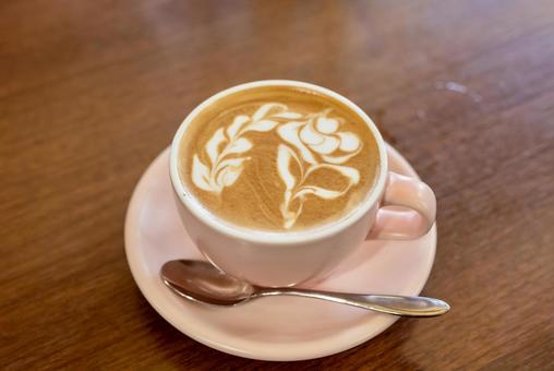 花のデザインが描かれたラテアートコーヒー 花のデザインが描かれたラテアートコーヒー ラテアート,カフェラテ,カフェの写真素材