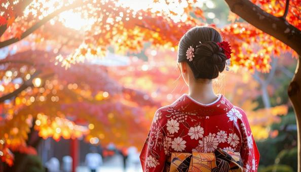 紅葉を眺める晴れ着姿の女性のポートレートの写真