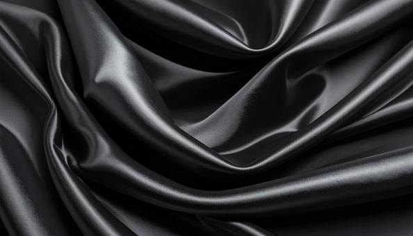 ドレープが美しい黒いシルクの背景の写真