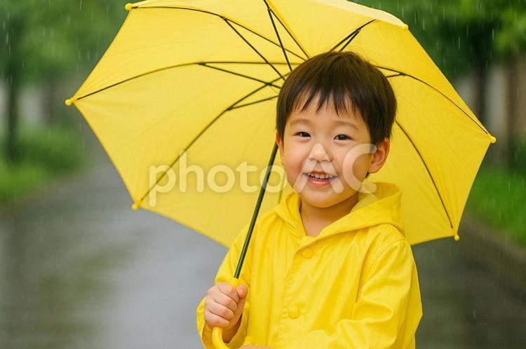 黄色い傘の子供と雨の日・レインコート 子供,雨,傘の写真素材