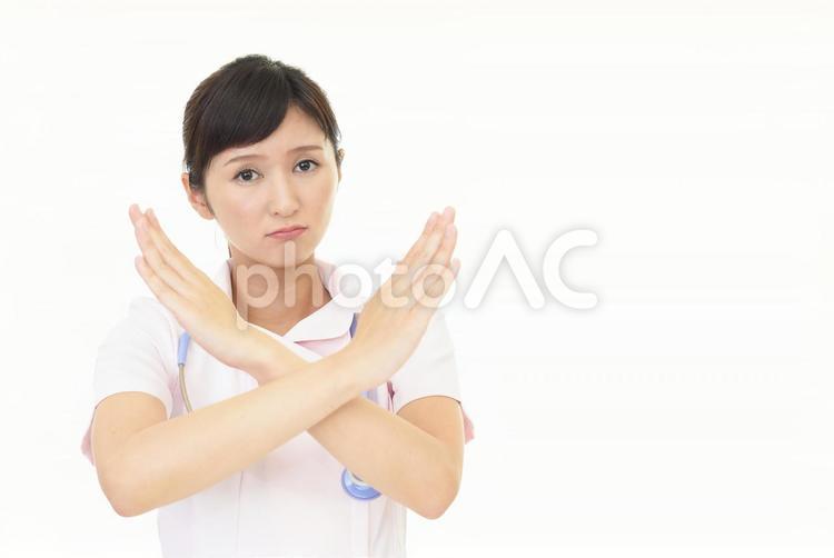 禁止のポーズをとる看護師 女性,看護師,看護士の写真素材