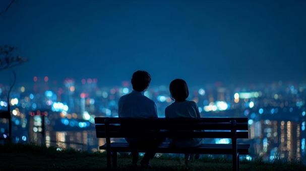 夜景デートを楽しむ男女の後ろ姿 夜景デートを楽しむ男女の後ろ姿の写真