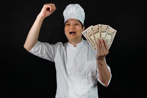 喜ぶ料理人とお金 料理人,シェフ,白い服の写真素材