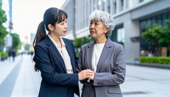 後悔して悩むビジネスウーマンたちの写真