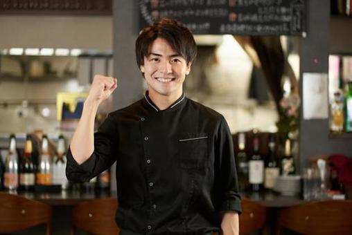 Asian man doing a guts pose at a restaurant Asian man doing a guts pose at a restaurant