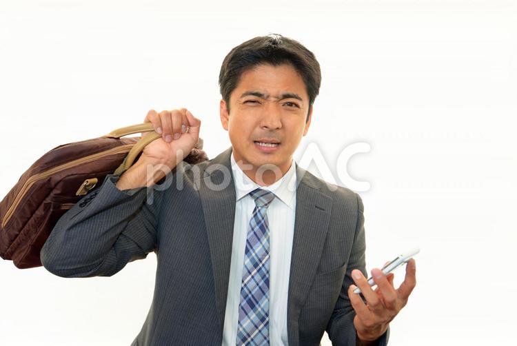 不安な表情のビジネスマン 男性,人物,ビジネスマンの写真素材