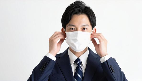マスクをつける人 マスクをつける人の写真