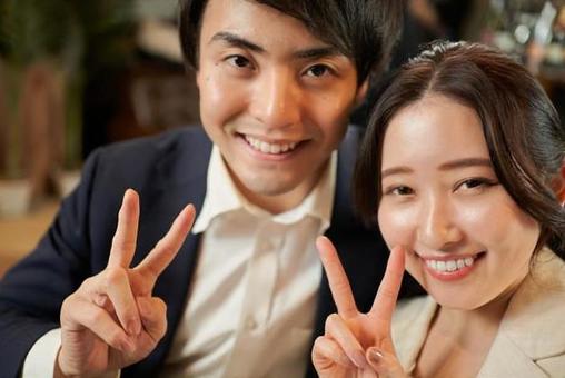 Asian couple making peace signs, piece, peace sign, hand, JPG