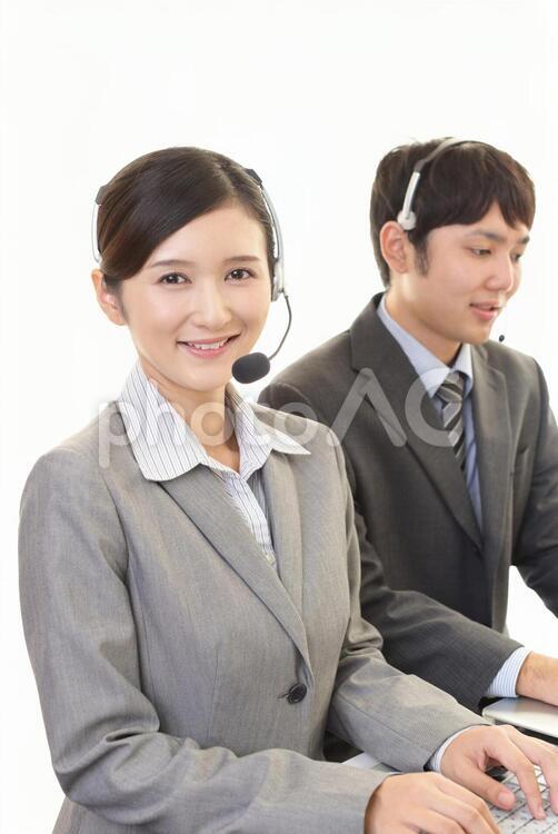 笑顔の二人のオペレーター オペレーター,男性,女性の写真素材