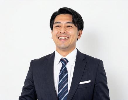 笑うビジネスマン 笑うビジネスマンの写真