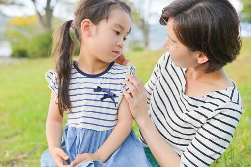 Mother and daughter chatting outdoors Summer Mother and daughter chatting outdoors Summer