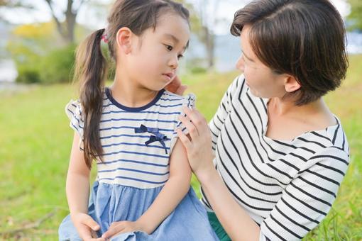 Mother and daughter chatting outdoors Summer, JPG