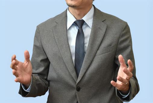 手ぶりを交えて話す男性 手ぶりを交えて話す男性 講義,講師,ブルーバックの写真素材