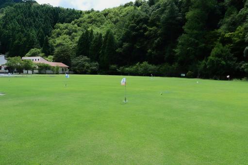 A ground golf course that stands out among the green trees and grass, JPG A ground golf course that stands out among the green trees and grass, JPG
